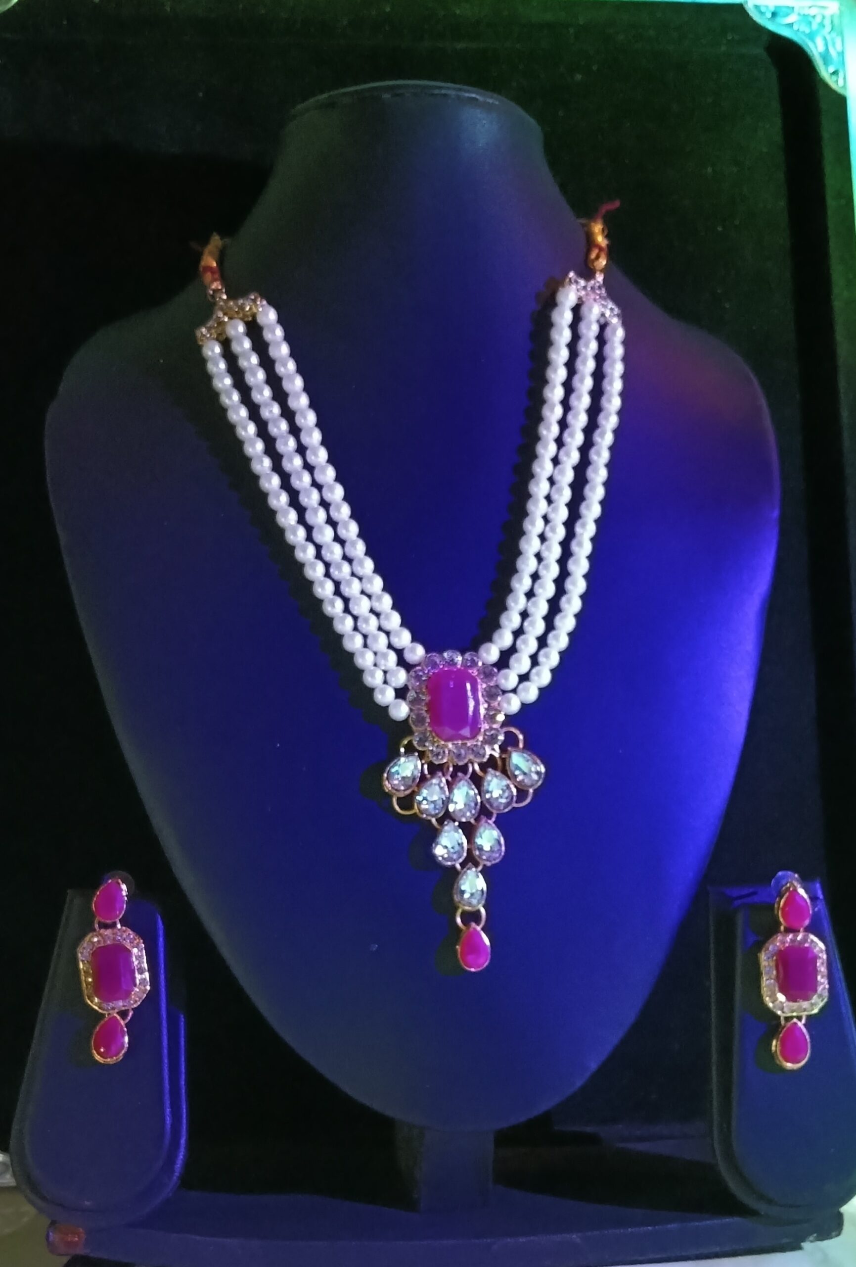 elegant multi layer pearl necklace set with a beautiful pink stone pendant and matching earrings elegant multi layer pearl necklace set with a beautiful pink stone pendant and matching earrings