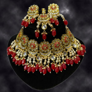 exquisite floral kundan choker set with vibrant red accents and maang tikka