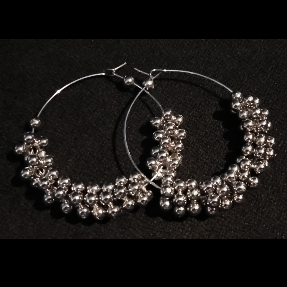 celebrate ethnic charm with this beautifully curated 4 pair oxidized silver earring combo. celebrate ethnic charm with this beautifully curated 4 pair oxidized silver earring combo.